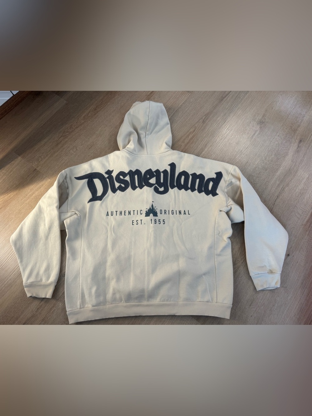 Disney Disneyland Cream Zip-Up Sweatshirt with Navy Logo